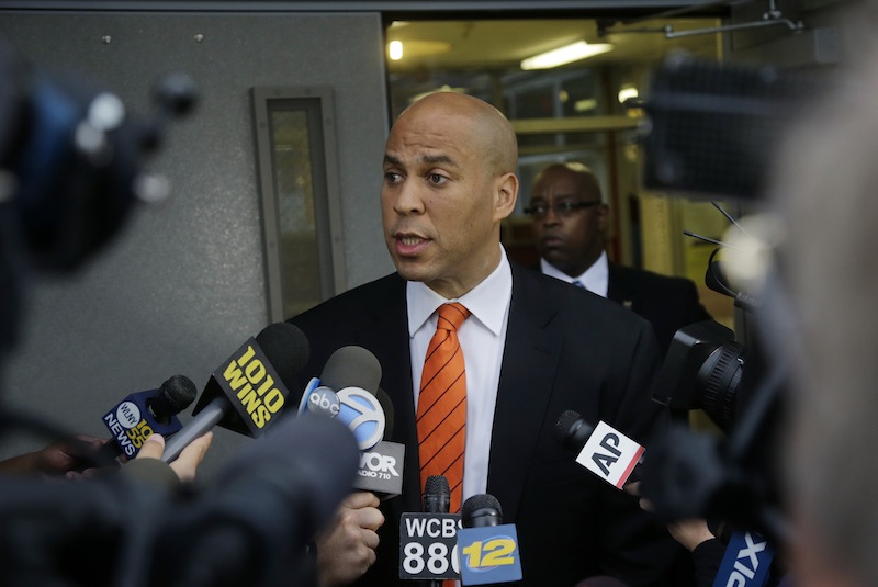 Newark Mayor and Senate candidate Cory Booker answers a question after he voted in a primary election Tuesday, Aug. 13, 2013, in Newark, N.J. Low turnout was expected Tuesday as New Jersey voters decide which candidates will run to fill the seat of the late U.S. Sen. Frank Lautenberg, who died in June. Democrat Booker and Republican Steve Lonegan are expected to easily win their party primaries. Barring an upset, the two will square off in an Oct. 16 special election, with the winner headed to Washington for the remaining 15 months of Lautenberg's term. (AP Photo/Mel Evans) Cory Booker
