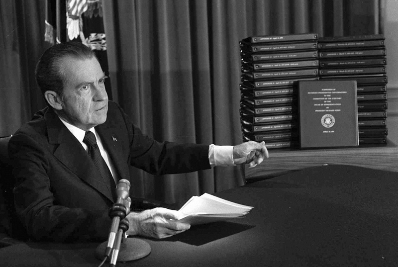 President Richard M. Nixon points to the transcripts of the White House tapes after he announced during a nationally-televised speech that he would turn over the transcripts to House impeachment investigators, on April 29, 1974, in Washington.