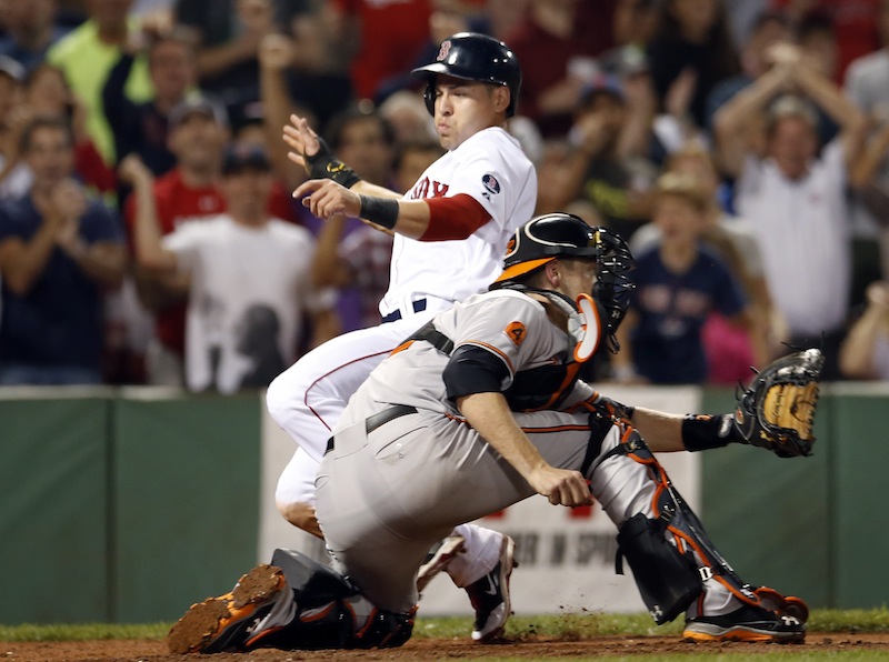 Jacoby Ellsbury slides into home to score on a single by Dustin Pedroia in the seventh inning at Fenway Park on Wednesday.