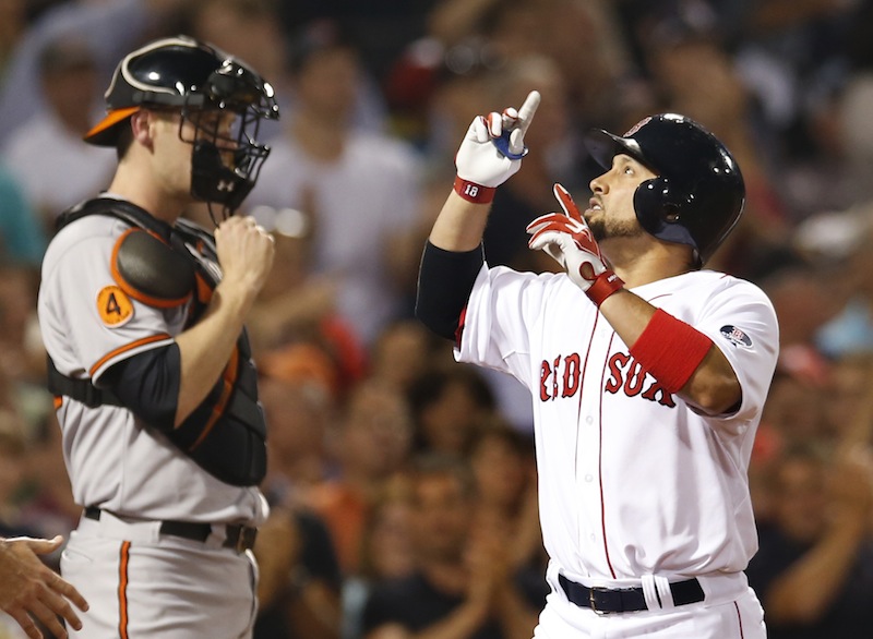 Boston's Shane Victorino, right, gestures as he crosses home plate after hitting a two-run homer while Baltimore Orioles catcher Matt Wieters watches at Fenway Park Tuesday.