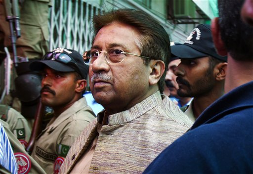 In this April 20, 2013, photo, Pakistan's former president and military ruler Pervez Musharraf arrives at an anti-terrorism court in Islamabad, Pakistan. A Pakistani court Tuesday indicted Musharraf on murder charges in connection with the 2007 assassination of iconic Pakistani Prime Minister Benazir Bhutto, deepening the fall of a once-powerful figure who returned to the country this year in an effort to take part in elections.