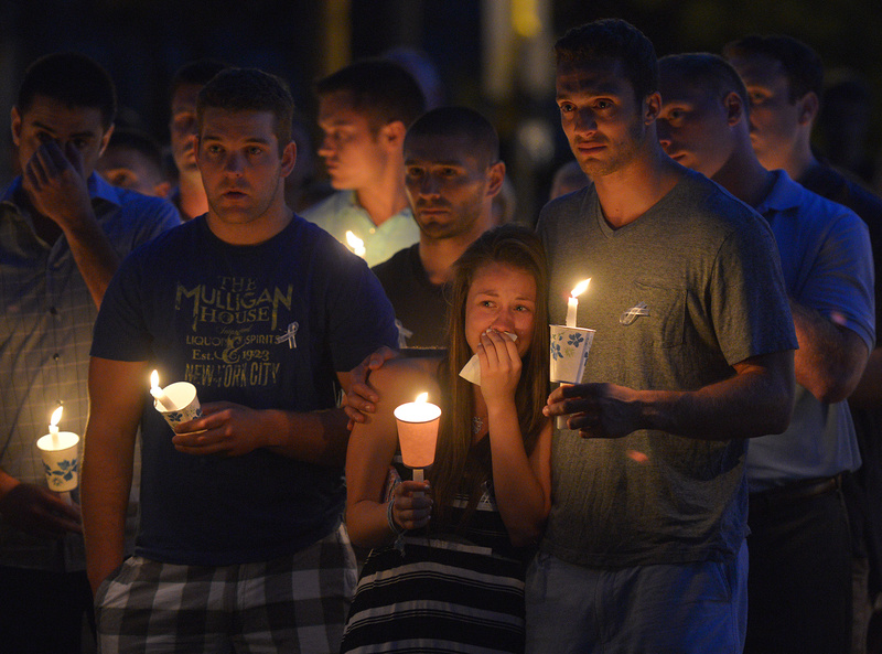 Friends and residents of Wilbraham, Mass., gather at Gazebo Park for a candlelight vigil for Amy Lord on July 24. Lord, a native of Wilbraham, was found stabbed to death at Hyde Park's Stony Brook Reservation last month.