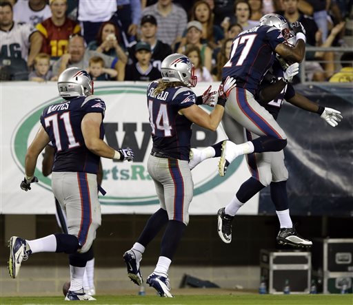 From right to left, New England Patriots' LeGarrette Blount, Aaron Dobson, Zach Sudfeld and R.J. Mattes celebrate after Blount's touchdown during the first half of a preseason NFL football game against the Philadelphia Eagles, Friday, Aug. 9 in Philadelphia. (AP Photo/Matt Rourke)
