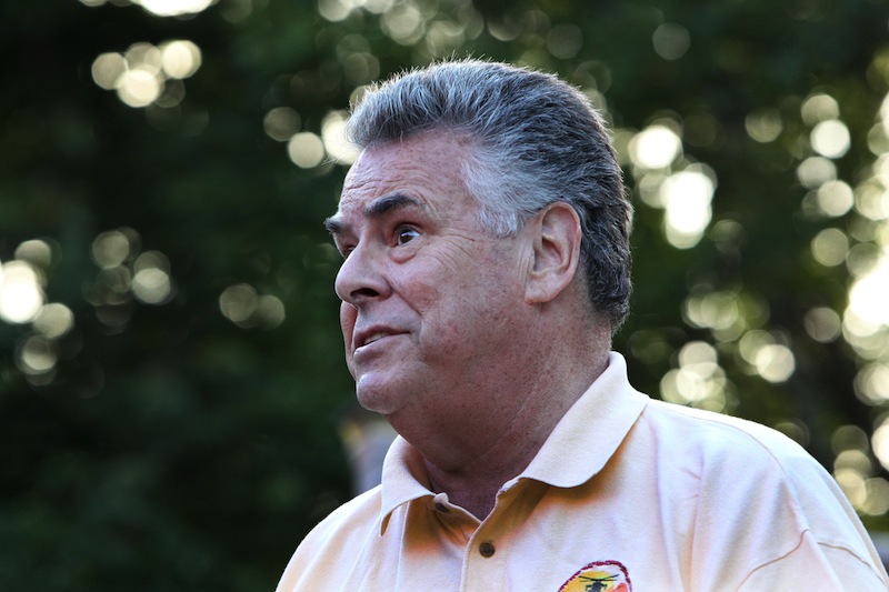 U.S. Rep. Pete King, R-N.Y. speaks at an outdoor barbecue at the home of Don Rowan, Sunday, Aug. 4, 2013 in Wakefield, N.H. King is considering running for president in 2016.(AP Photo/Jim Cole)