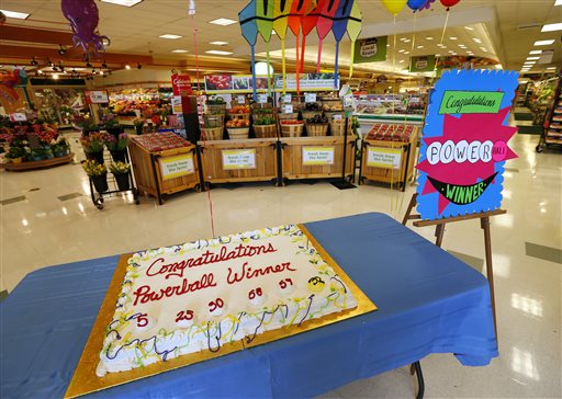 A cake celebrating a Powerball winner sits on a table near the entrance of Stop & Shop in South Brunswick, N.J., on Thursday. One of the three winning Powerball tickets was sold at this store.