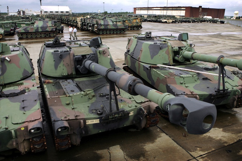 In this 2005 file photo, 380 M-109 Howitzers tanks and 800 Humvees, along with other military vehicles, await refurbishing at the Maine Military Authority in Limestone. The Maine Military Authority is laying off 140 people beginning in October because of the drawdown of troops and equipment in Iraq and Afghanistan. (AP Photo/Robert F. Bukaty)