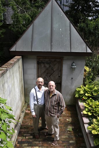 On Monday, July 29, John Gacher, 61, left, and Federico Santi, 66, right, both of Newport , R.I., in front of a garden shed at their home. The couple planned to turn their civil union into a marriage Thursday morning at Newport City Hall. (AP Photo/Steven Senne)