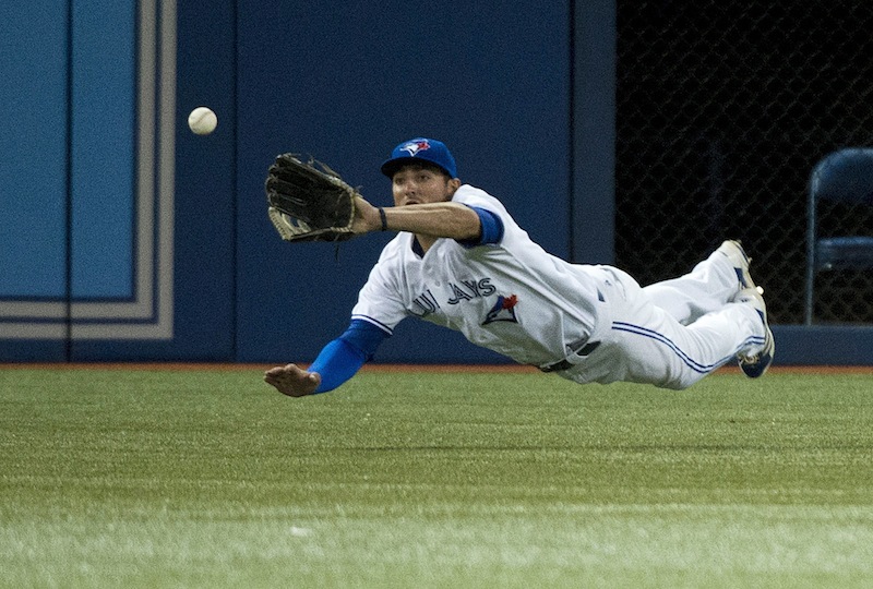 Toronto Blue Jays left fielder Kevin Pillar makes diving catch of a ball hit by Boston Red Sox' Jonny Gomes during the sixth inning of a baseball game in Toronto on Wednesday, Aug. 14, 2013. (AP Photo/The Canadian Press, Nathan Denette) Blue Jays;athlete;athletes;athletic;athletics;Canada;Canadian;Center;Centre;competative;compete;competing;competition;competitions;event;game;Jays;League;Major;MLB;pro;professional;Rogers;sport;sporting;sports;Toronto;baseball;American;AL;2013