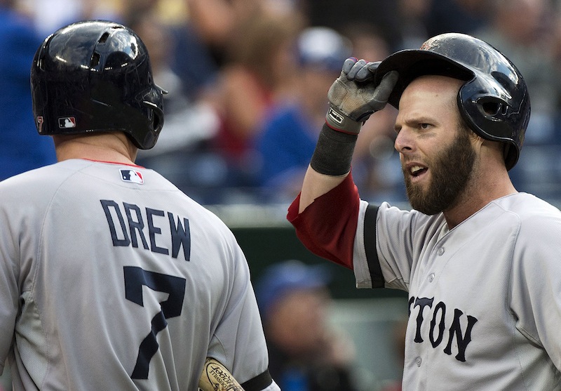 Boston Red Sox second baseman Dustin Pedroia, right, reacts to his teammate Stephen Drew after Pedroia was tagged out at home plate against the Toronto Blue Jays on Thursday in Toronto.