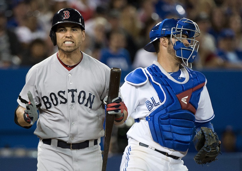 Jacoby Ellsbury reacts after striking out next to Toronto Blue Jays catcher J.P. Arencibia Thursday in Toronto.
