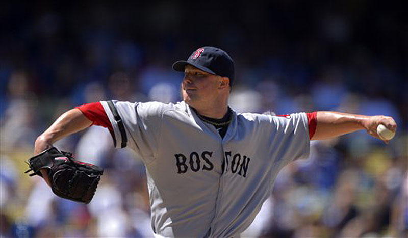 Red Sox starting pitcher Jon Lester throws to the plate in the fourth inning against the Los Angeles Dodgers on Saturday in Los Angeles.