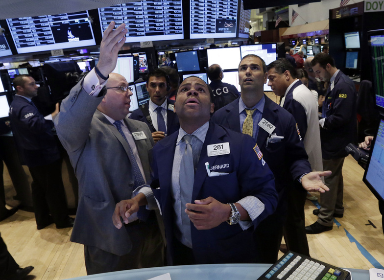 Specialists Peter Kennedy, Bernard Wheeler and Philip Finale confer on the floor of the New York Stock Exchange on Wednesday. Global markets rose Thursday.