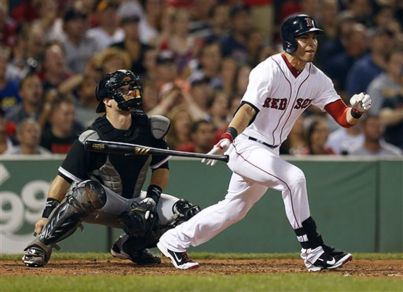 Jacoby Ellsbury follows through on a ground-rule double in front of Chicago catcher Josh Phegley in the fourth inning at Fenway on Saturday.