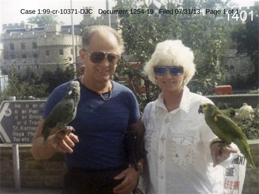 This undated photo filed in federal court documents in Boston by defense attorneys for James "Whitey" Bulger shows him with an unidentified woman holding birds in an unknown location.