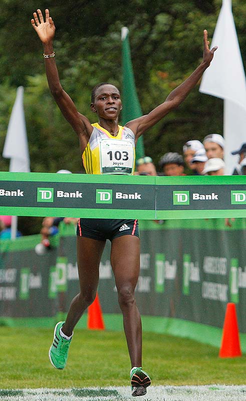 Joyce Chepkirui of Kenya crosses the finish line of the TD Beach to Beacon 10K Road Race on Saturday as the first female finisher with a time of 31 minutes, 23 seconds.