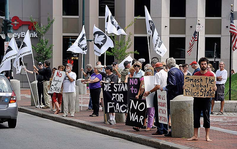 The Veterans for Peace, Code Pink and Peace Action Maine held a rally Saturday against US intervention in Syria. Michael Anthony of Portland, right, joined the rally with other objectives.