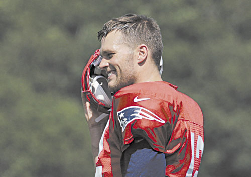 New England Patriots quarterback Tom Brady limped off the practice field Wednesday.