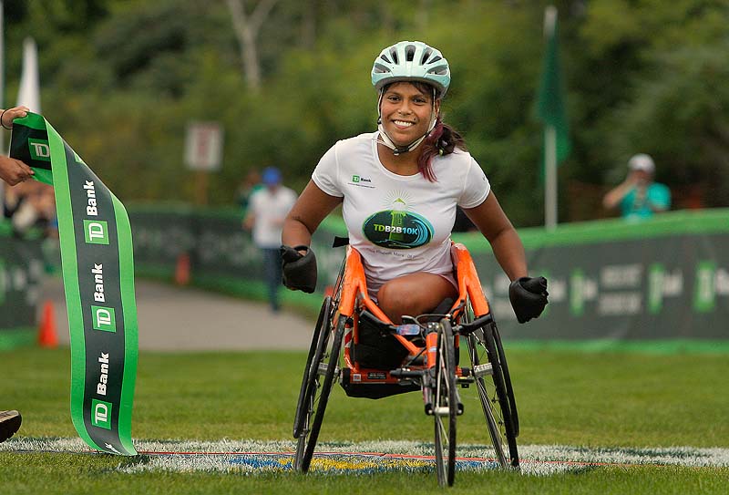 Christina Kouros might have been the only woman in the wheelchair division, but she posted her best time on her hometown course. “My town knows I do my best,” she said.