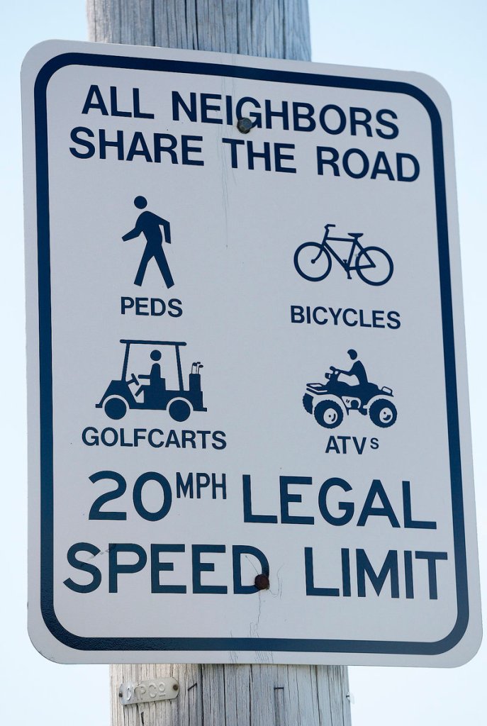 A Long Island sign encouraging people to share the road with the multiple vehicles, including golf carts. Photographed on Thursday, August 1, 2013.