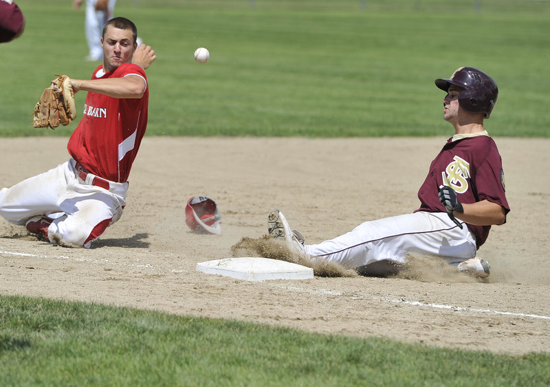 Drew Gelinas of Fayette-Staples of Saco slides into third base Thursday as shortstop Chandler Shostak of Red Barn of Augusta stops an errant throw from going into left field. Red Barn scored five runs in the ninth inning to remain alive and eliminate Fayette-Staples with an 11-10 victory.