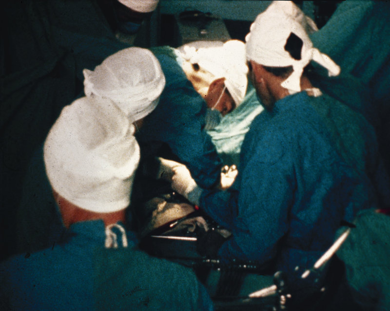 An undated photo shows pioneering cardiac surgeon Dr. Christiaan Barnard, second from right, performing heart surgery. There are 4,964 people waiting for an organ donation in Region 1, which includes Maine.