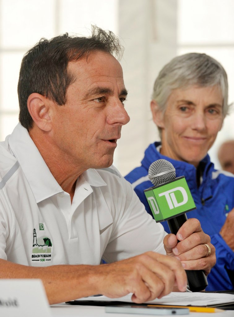 Race director Dave McGillivray addresses the media Friday. At right is race co-founder Joan Benoit Samuelson.