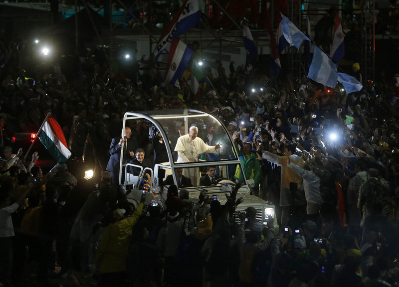 Pope Francis waves from his popemobile as he makes his way through the crowds lining the Copacabana beachfront in Rio de Janeiro, Brazil, last month, during his first international trip since being elected pope.
