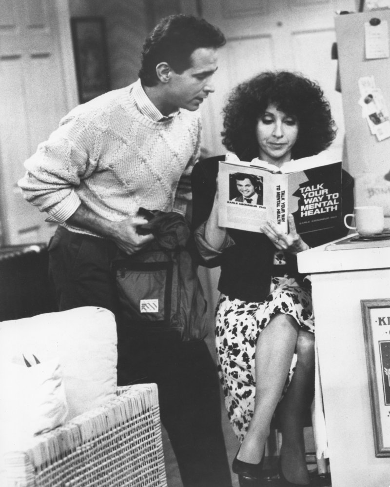 Roxie, played by 1965 Deering High School graduate Andrea Martin, studies up on group therapy with her TV show husband, Mitchell Laurance, during a 1987 episode of “Roxie” on the CBS Television Network.