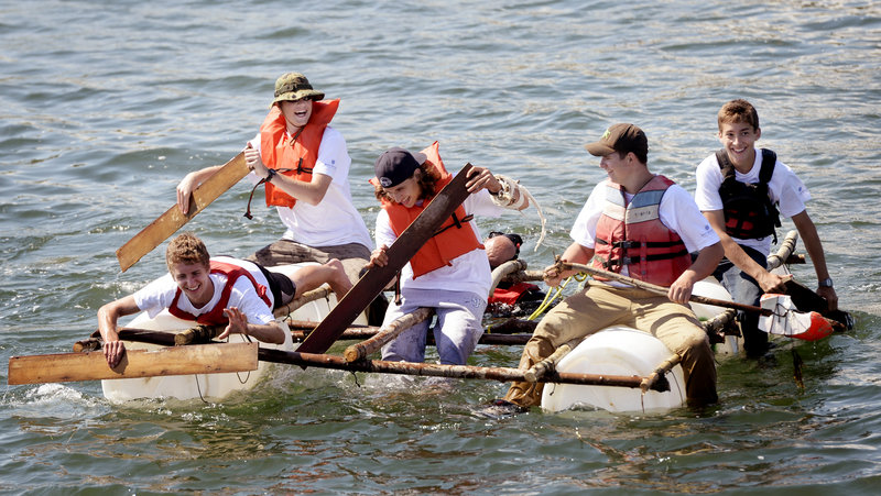 Science Island Extreme participants paddle a raft they built while on Little Chebeague Island. They are, from left, Tyler Sym of Lexington, Mass.; Adam Josselyn of Oxford Hills; Mario Conte of Long Island, N.Y.; Ryan McLaughlin of Kingston, N.H., and Galen DuBois of Woolwich.