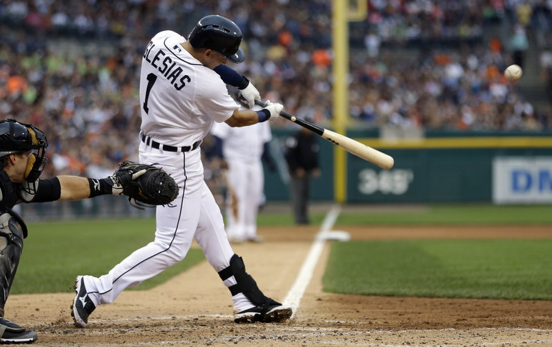 Detroit’s Jose Iglesias drives home Prince Fielder from third base during fourth-inning action of Friday’s Tigers-Chicago White Sox game in Detroit.