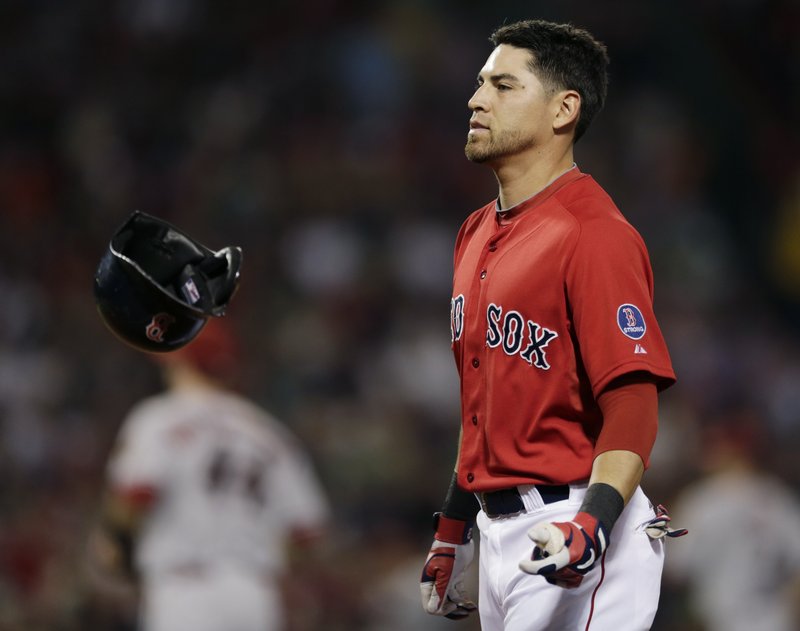 Jacoby Ellsbury of the Boston Red Sox flips his helmet Friday night after flying out with the bases loaded to end the fourth inning – part of a 7-6 loss to the Diamondbacks.