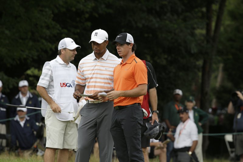 Although Tiger Woods, center, has four PGA tour wins this year, he’s fallen flat on the major scale for five straight years. But he still has 14 overall, a dozen more than Rory McIlroy, right, who’s endured a string of disappointments since last year’s success.