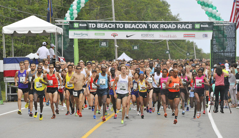 Runners jockey for position at the start of the race on Route 77.
