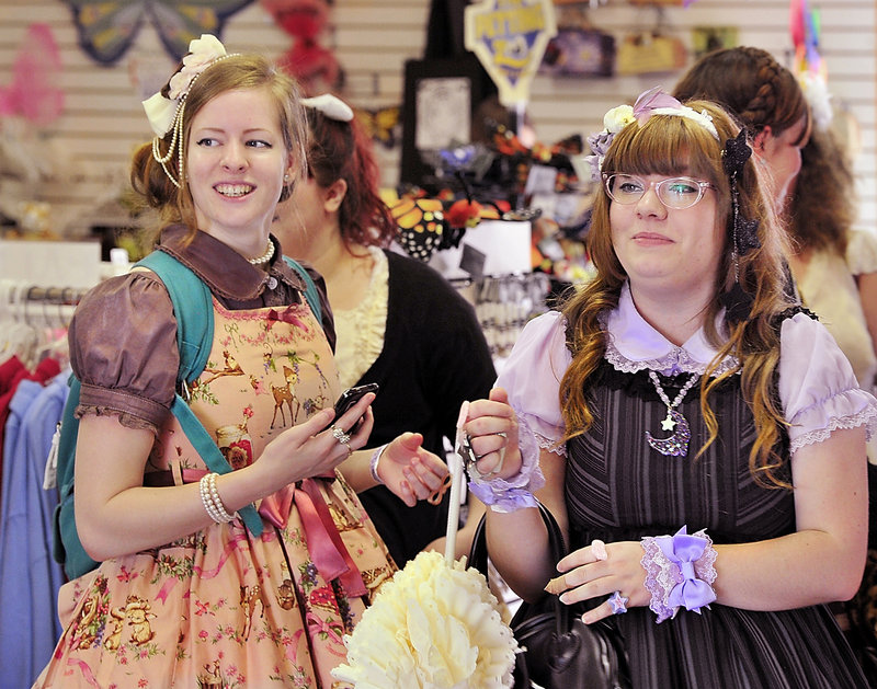Maine Lolitas Rebecca Cole of Gray and Alesha Leach of Kennebunkport are all dolled up in their outfits at a gift shop at York’s Wild Kingdom on Saturday.