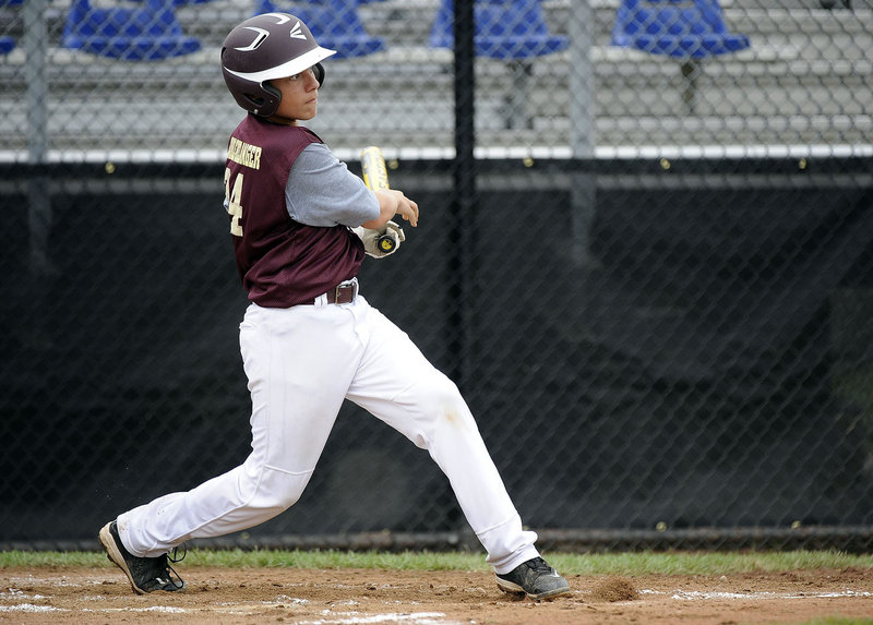 Brogan Searle-Belanger of Saco follows through on his three-run homer. Saco will play Westport, Conn., on Sunday night in the third of its four group games.