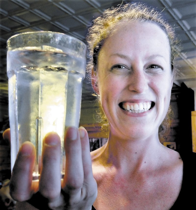 Amber Strickland holds a glass full of water from the Bingham water supply at Thompson’s restaurant recently. Strickland said she has lived all over New England and Bingham water is the best tap water she has had. “We have never heard a complaint from customers,” Strickland said.
