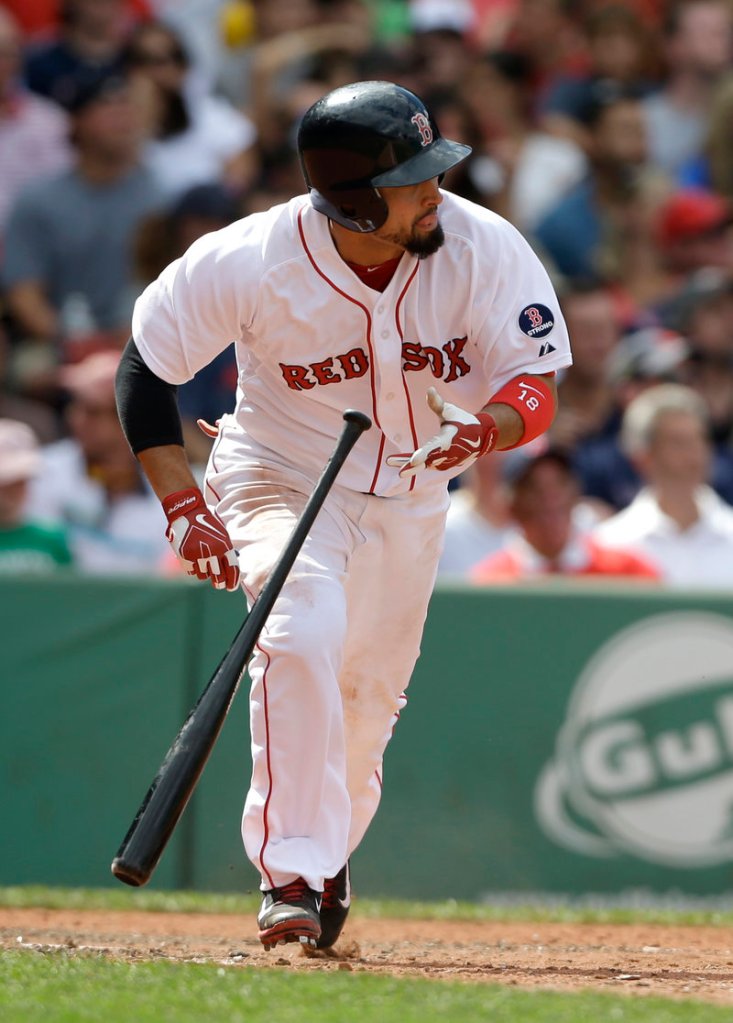 Shane Victorino heads for first base after hitting an RBI single for the Red Sox in the sixth inning of their 4-0 win over Arizona on Sunday.