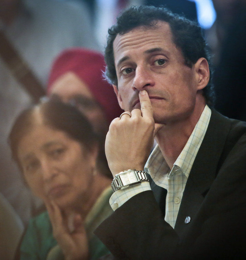 New York mayoral candidate Anthony Weiner, listens during a meeting with leaders from the South and East Asian communities in Queens on Friday. By staying in the race, Weiner will “have millions of dollars’ worth of polished ads that could improve people’s opinions of him. It’s not harebrained,” says political consultant Joseph Mercurio.