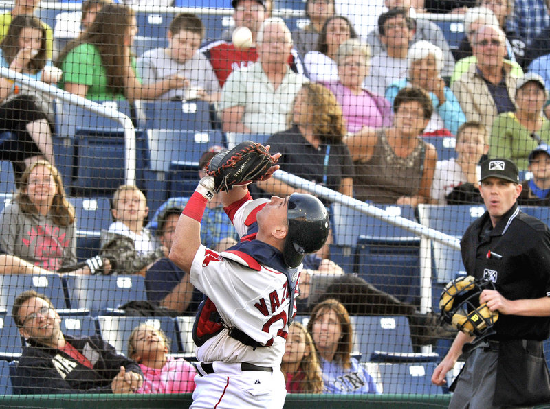 Portland catcher Christian Vazquez keeps his eyes on the ball Tuesday night while hauling in a foul pop fly at Hadlock Field during an 8-2 loss to the Richmond Flying Squirrels that dropped the Sea Dogs to three games under .500.