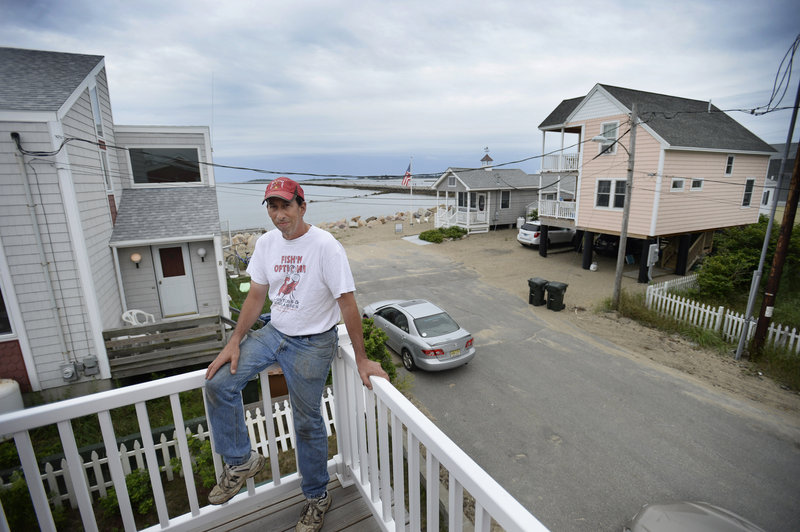 Dean Coniaris of Camp Ellis has a view of the jetty and Saco Bay from his porch on Eastern Avenue. He remembers the 1978 winter nor’easter that brought down as many as 18 houses along the shore.