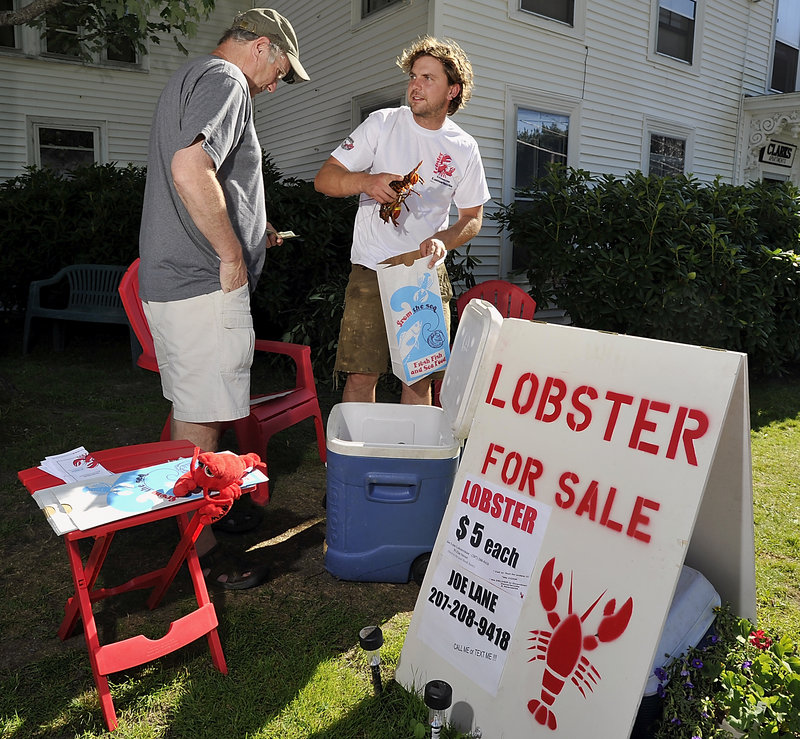 Lobsterman Joe Lane bypasses dealers and sells his catch directly to customers. He offered pound to pound-and-a-quarter lobsters at $5 each Tuesday from his home in Damariscotta.
