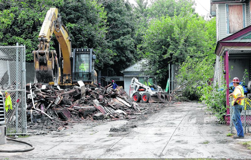 The Cleveland home of Ariel Castro is razed Wednesday as part of a plea deal that also led to his being sentenced to life in prison plus 1,000 years.