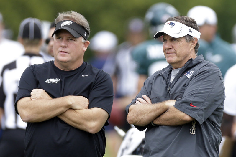 New Eagles coach Chip Kelly, left, and Patriots Coach Bill Belichick meet at a joint workout on Wednesday in Philadelphia. The teams play Friday night.