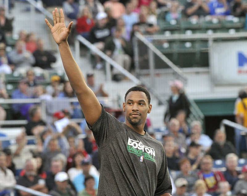 Jared Sullinger of the Boston Celtics arrived too late to throw out the first pitch but acknowledged the crowd during the game.