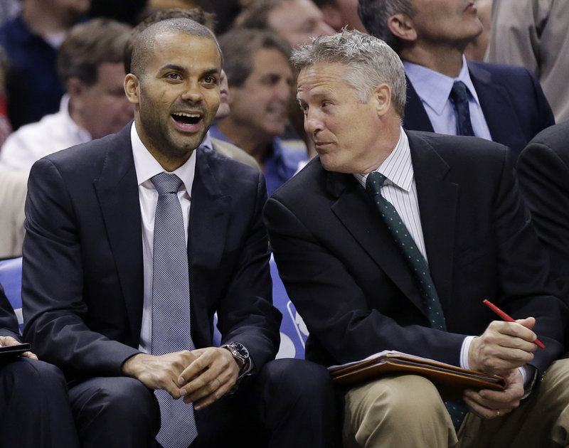 Tony Parker, left, flourished with the San Antonio Spurs after receiving help from Brett Brown, right.