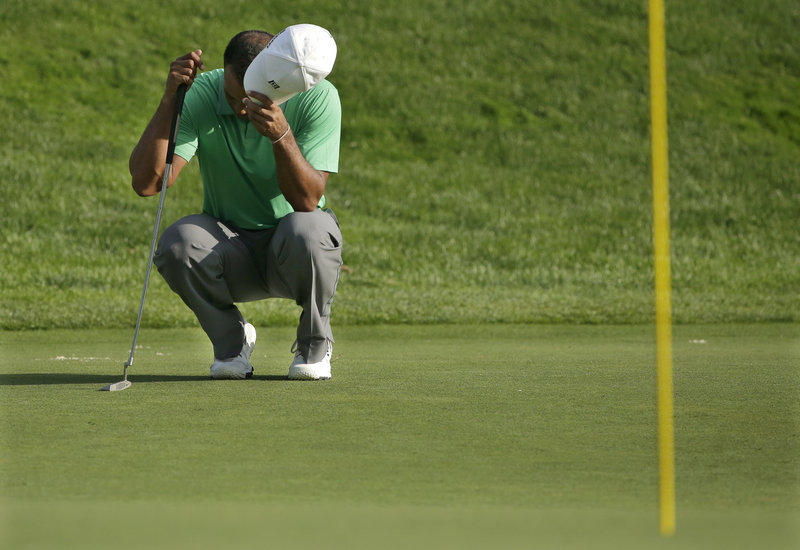 Tiger Woods struggles on the greens resulted in an even-par 70 and a 1-over 141 after two rounds, leaving him 10 strokes back going into weekend play.
