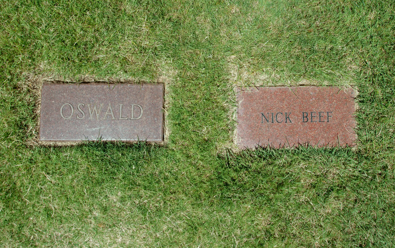 The headstone marking the grave of Lee Harvey Oswald lies next to a marker inscribed with the name Nick Beef, at Shannon Rose Hill Cemetery in Fort Worth, Texas.