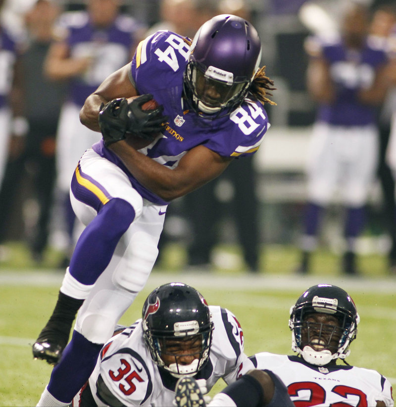 Cordarrelle Patterson leaps over two Houston defenders for good yardage during Minnesota’s 27-13 loss in the preseason opener for both teams Friday night.