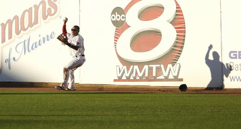 Johnson shows that, yes, he does have the ball after making the catch at the top of the right-field fence.
