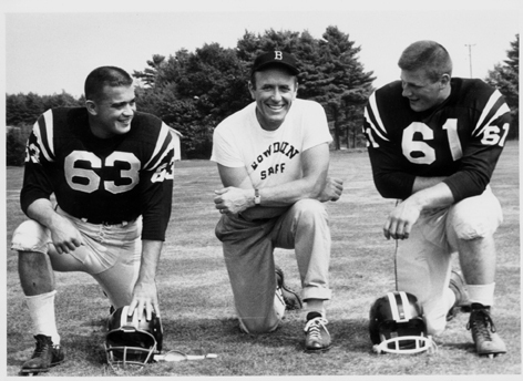 C. Nels Corey loved nothing better than to be with his football players while coaching at Bowdoin College. In 1962 that included Charlie Speleotis, left, and Dave Fernald.